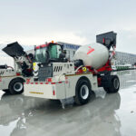 Self loading concrete mixer truck working in remote construction area